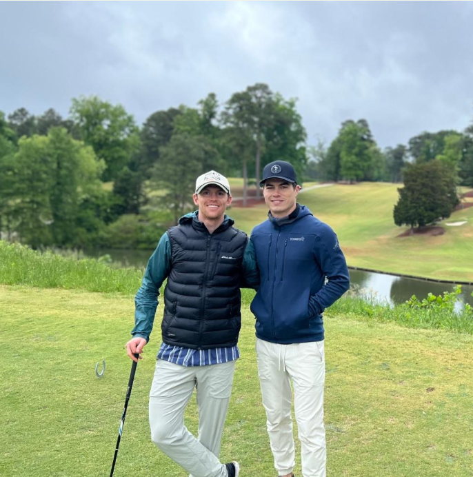 Matt and Tanner together on a golf course