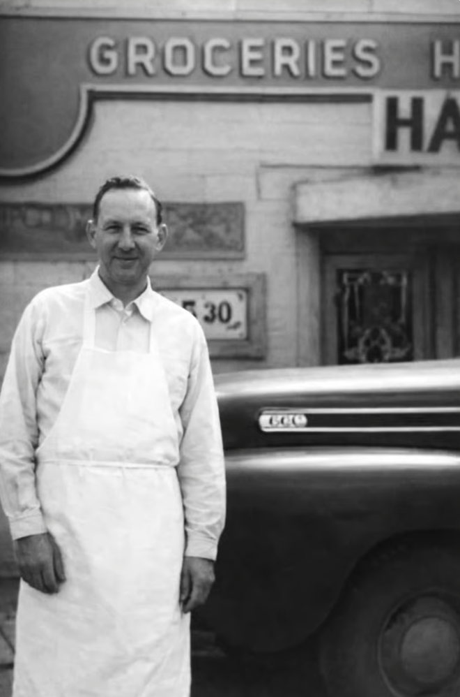 Tanner's grandfather, Don Hale, standing in front of Hale's Market grocery store